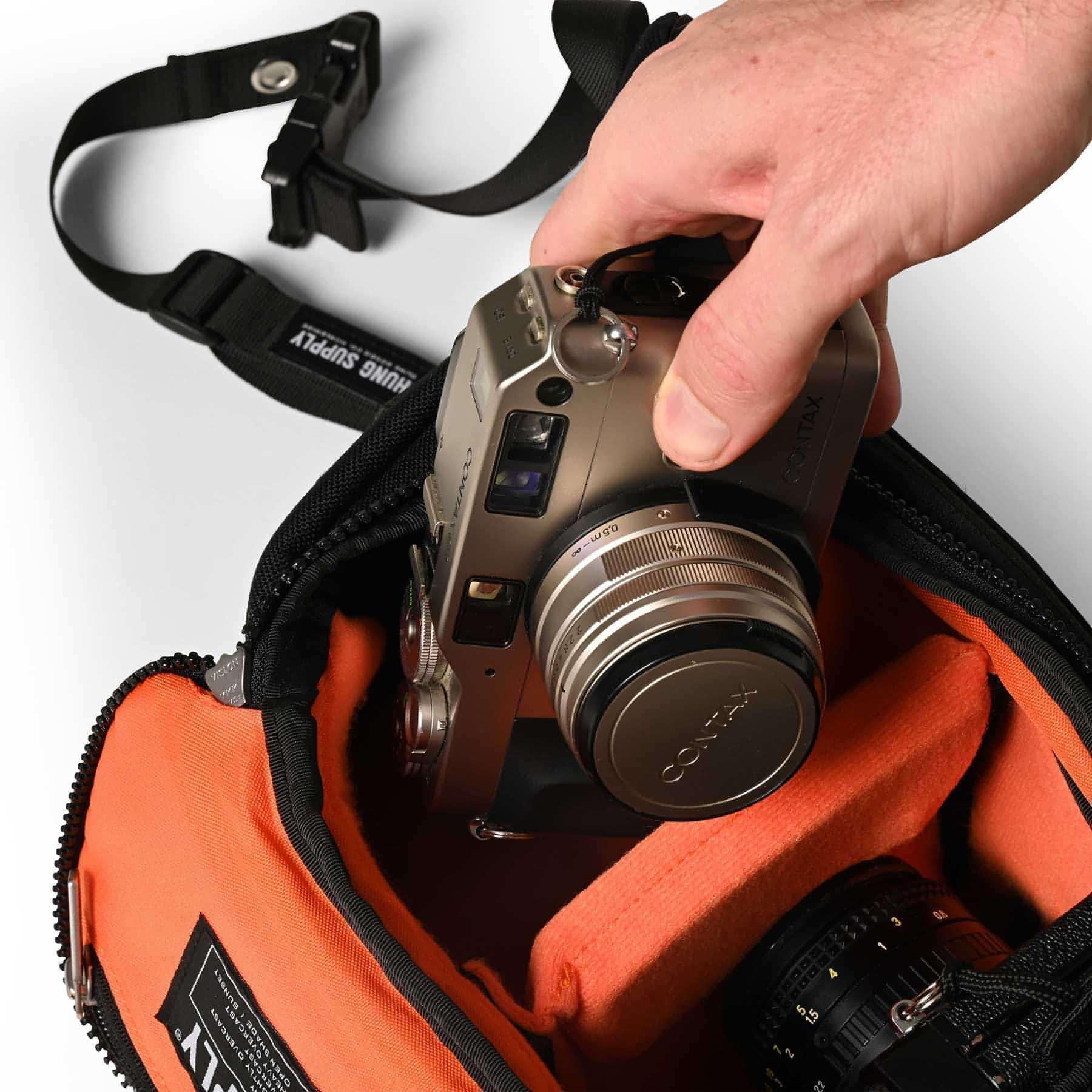 Lens sling shop
